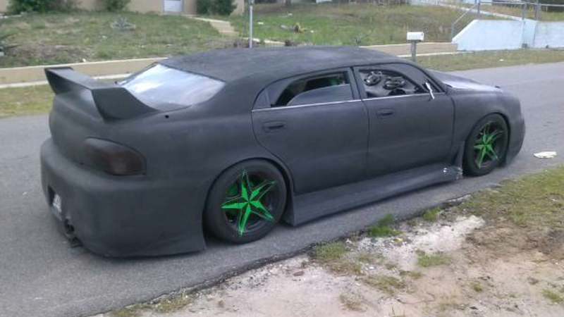 Illustration for article titled This 'Custom' Mazda 626 Is Proof That Energy Drinks Are Bad For You